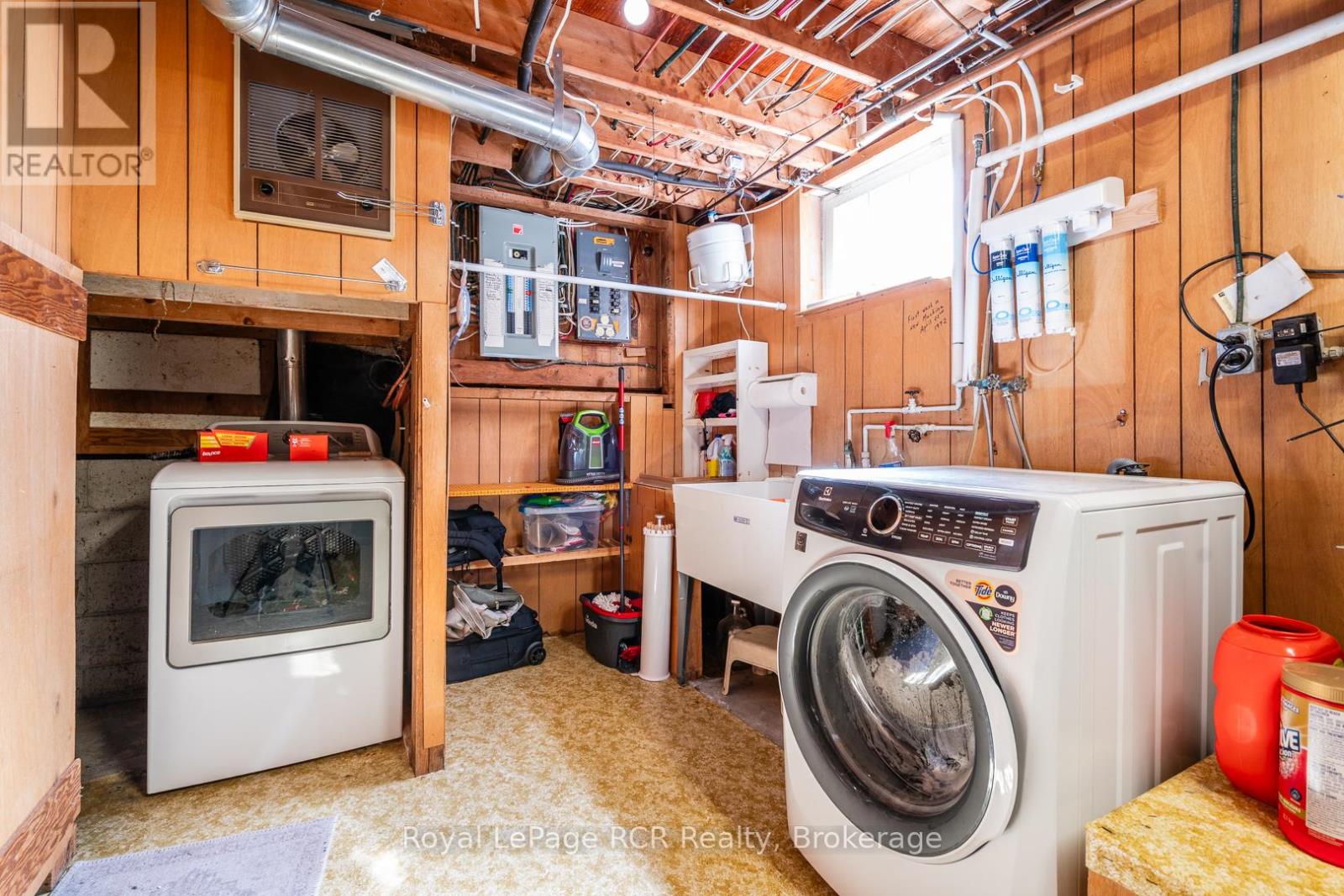utility room with laundry and 2 piece bathroom