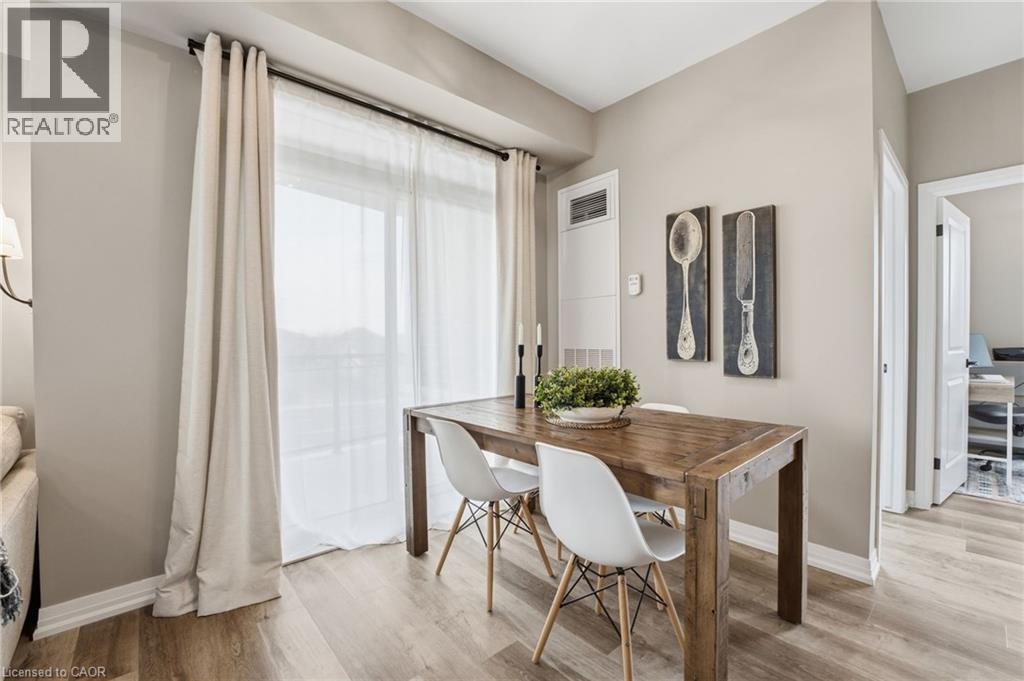 Dining space featuring baseboards and light wood finished floors