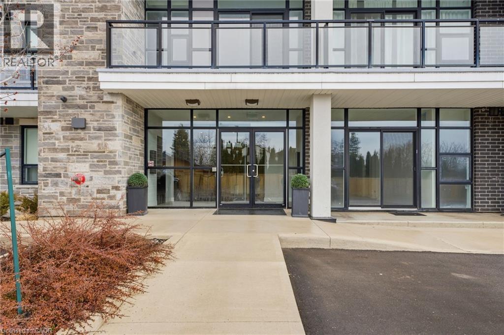 Property entrance featuring a patio and stone siding