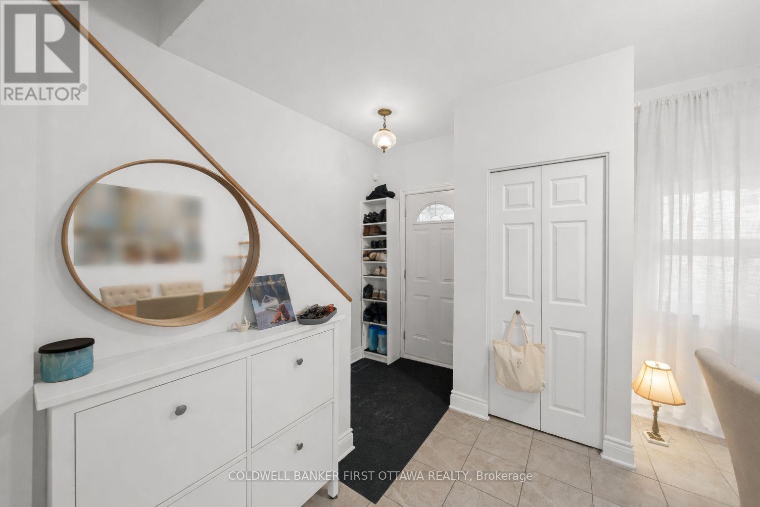 Front foyer w ceramic tiled floor & hall closet.