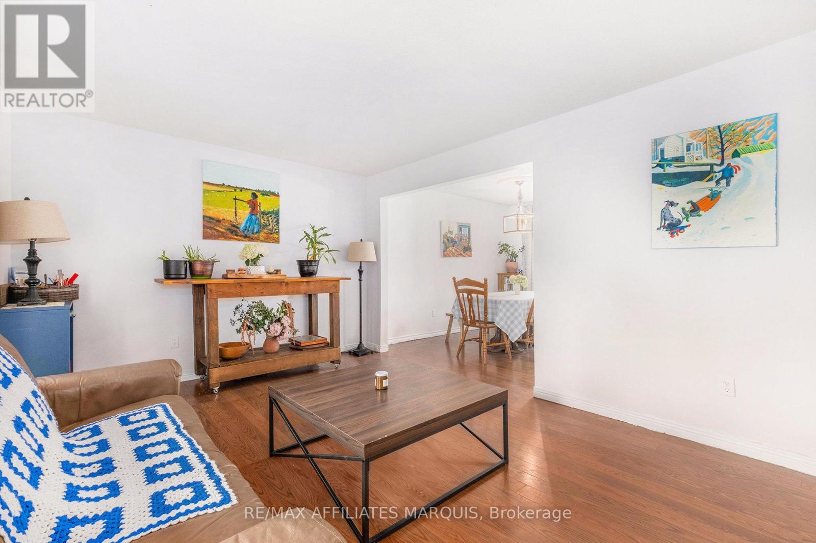Bright living room flows seamlessly to dining area