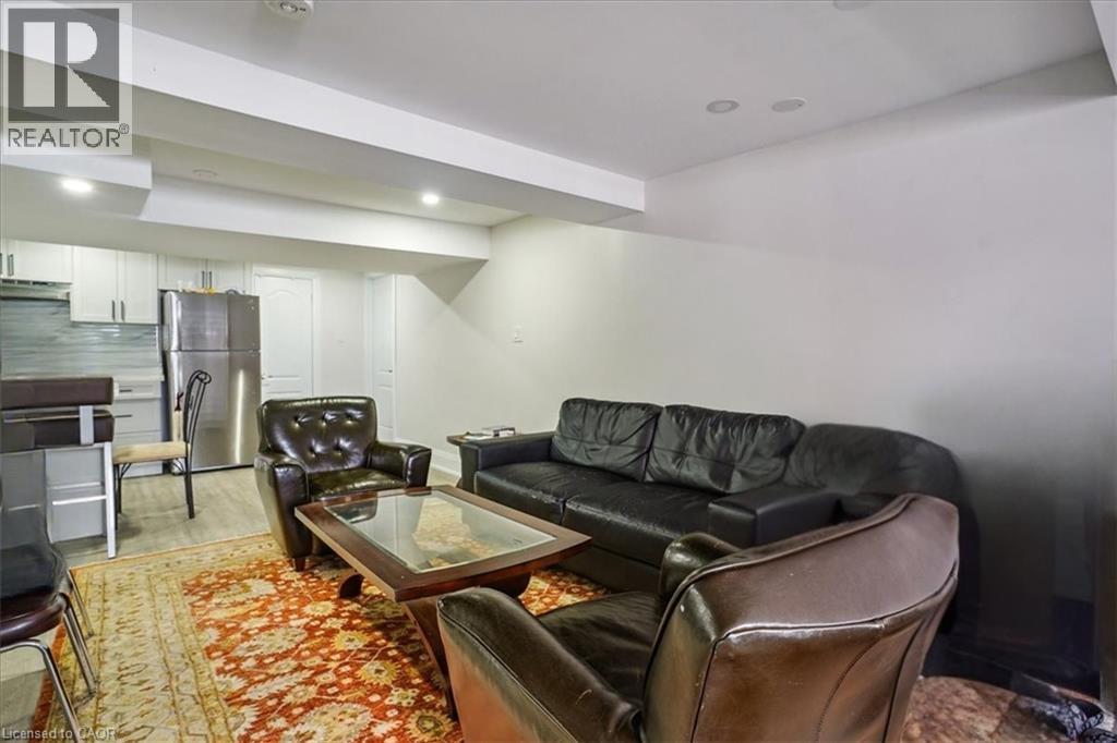 Living room featuring wood finished floors and recessed lighting