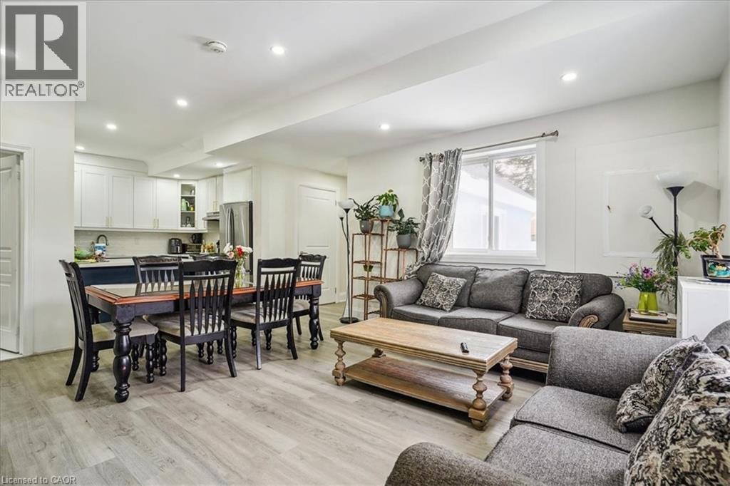 Living room featuring light wood-type flooring and recessed lighting