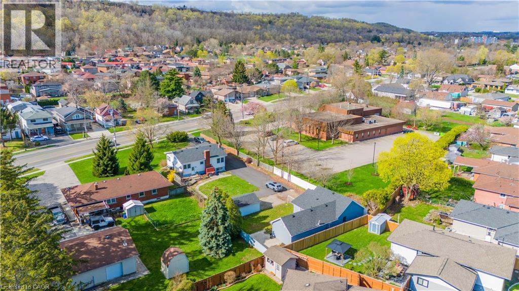 Aerial perspective showcasing a residential area with varied housing styles and mature trees