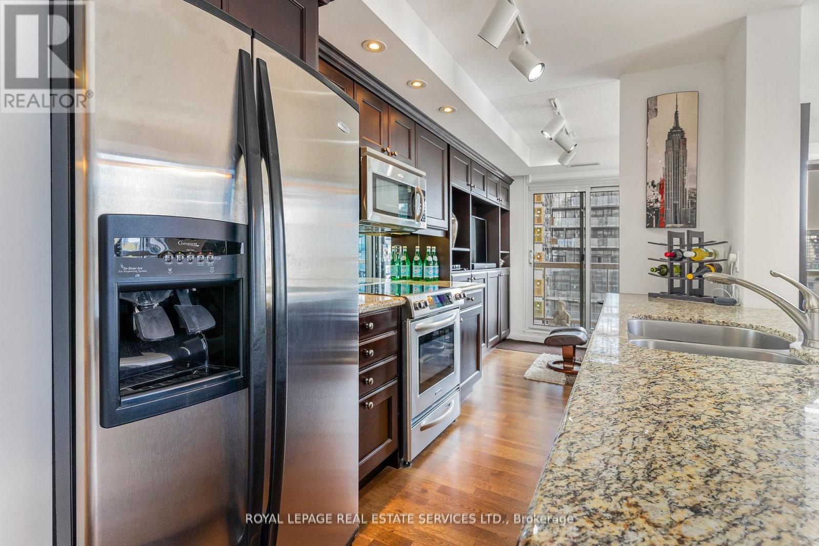 Kitchen Flowing Into Den (Wall Removed)
