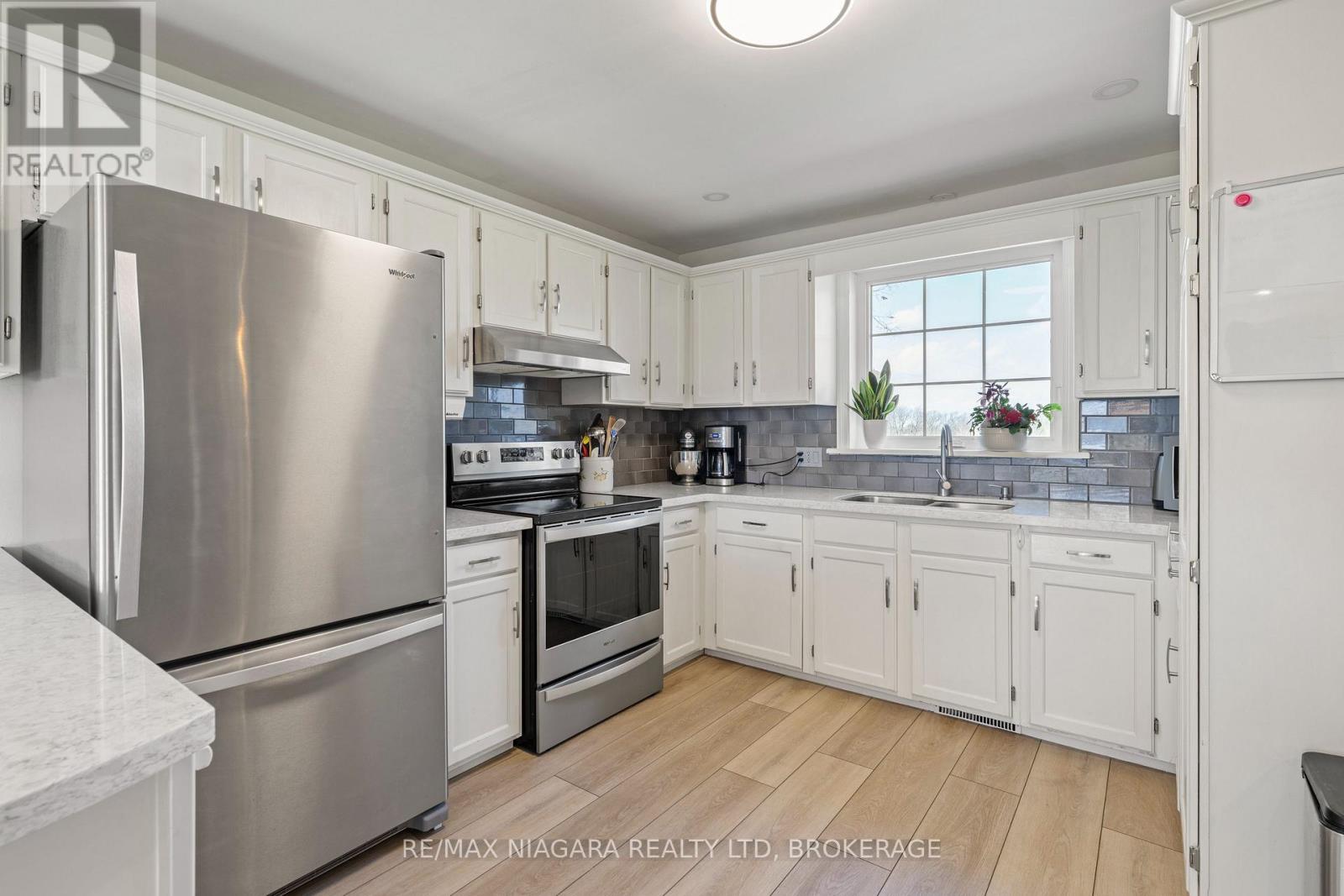 Refreshed cabinets with quartz countertop