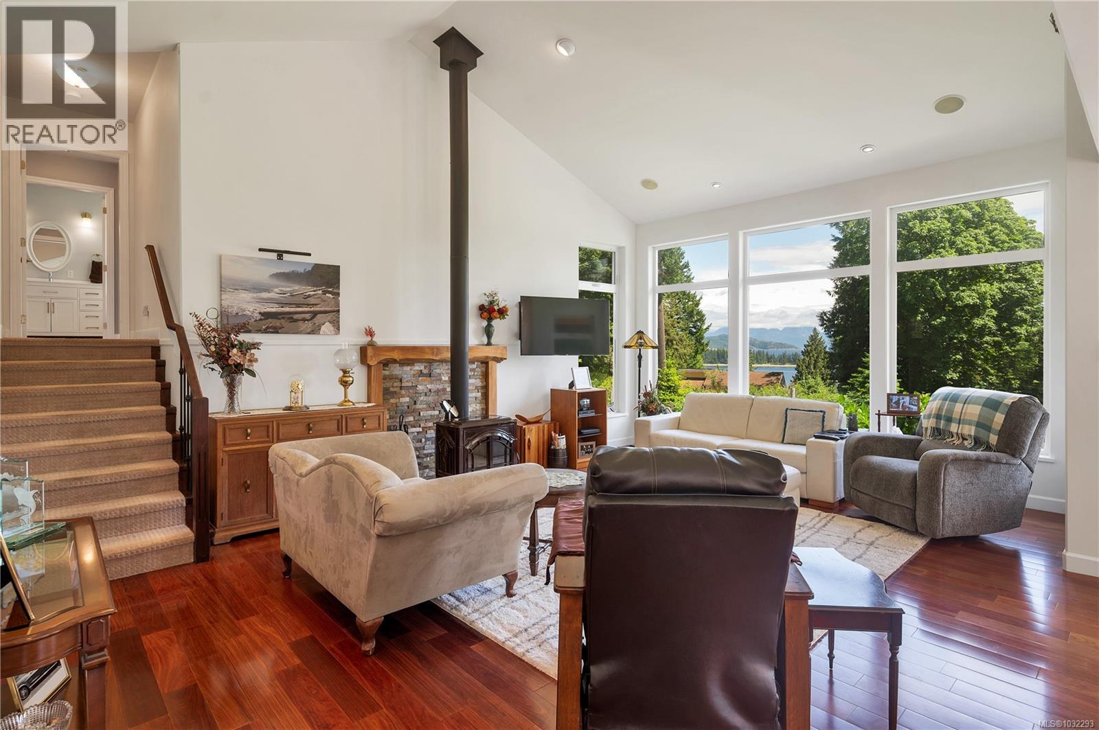living room, steps up to the laundry room & primary bedroom