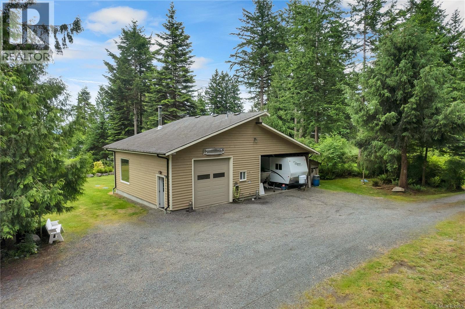 30'x50' garage/carport building with its own 200amp service, it is wired & plumbed with 3pc bathroom & connected to septic.  The carport offers more covered storage space.