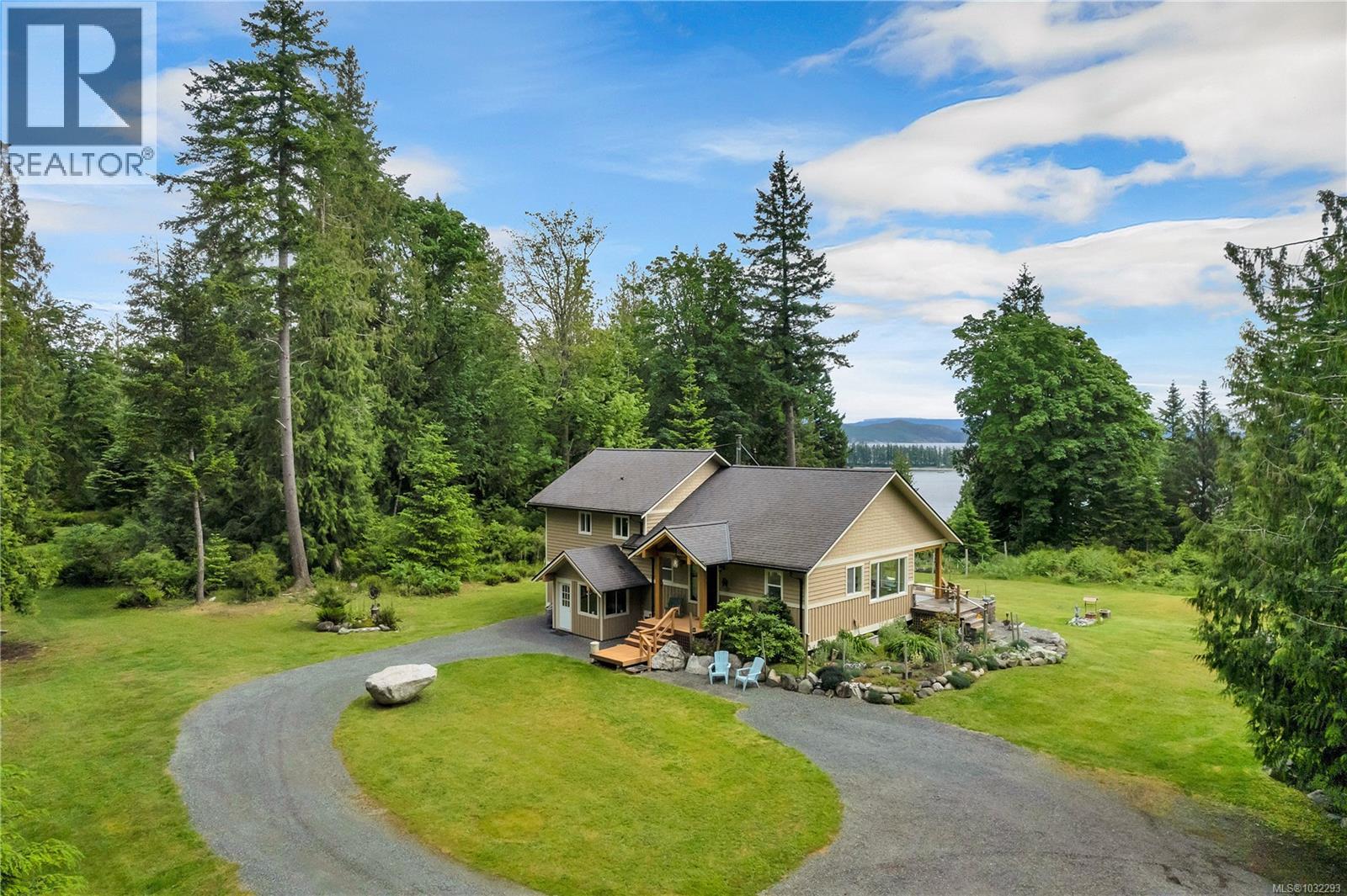 aerial of back/west side of home & driveway/parking areas