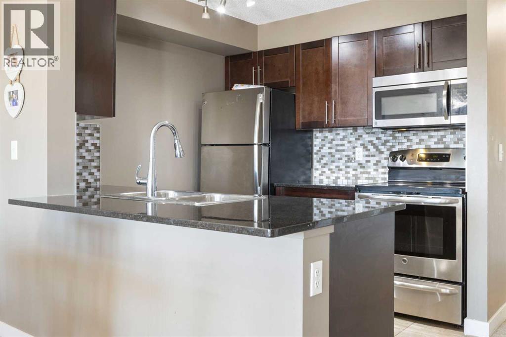 #312 5 SADDLESTONE WAY NE - 14
