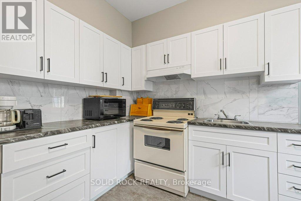 Kitchen has ancient stove in good working order