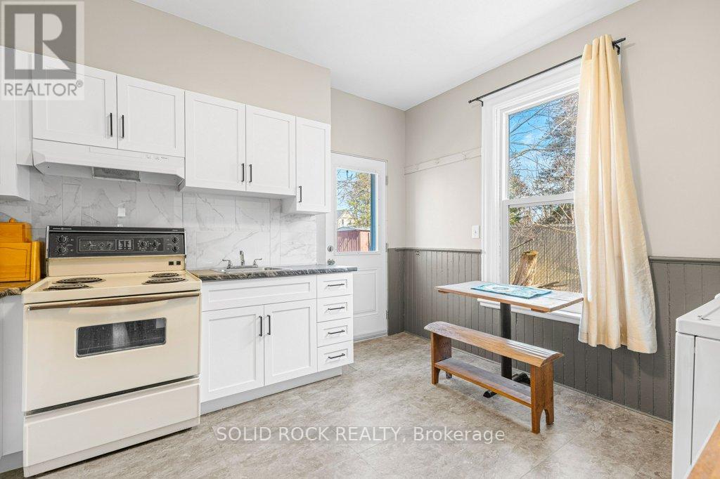 Kitchen with sitting area in front of huge window