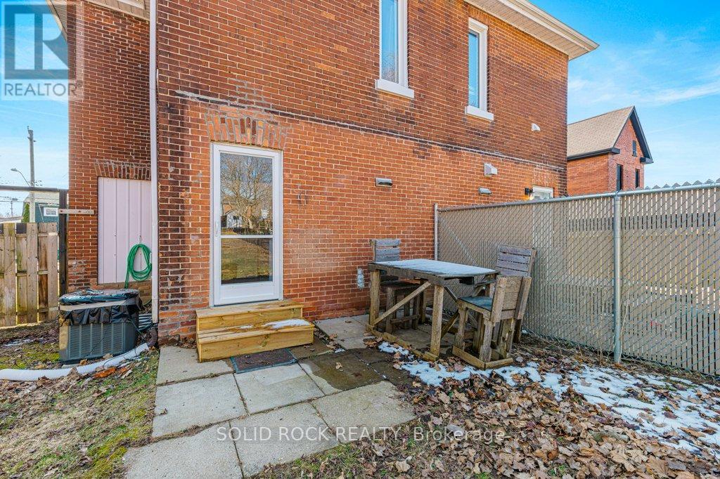 Rear sitting area next to privacy fence