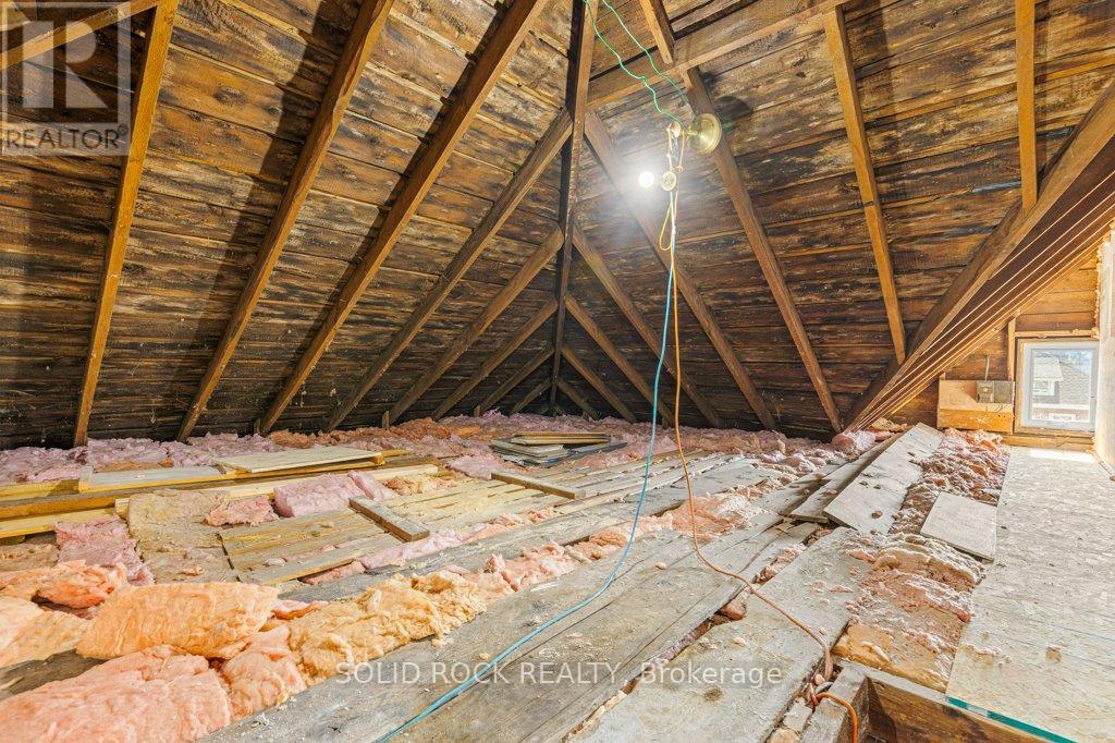 Full height attic accessible from staircase