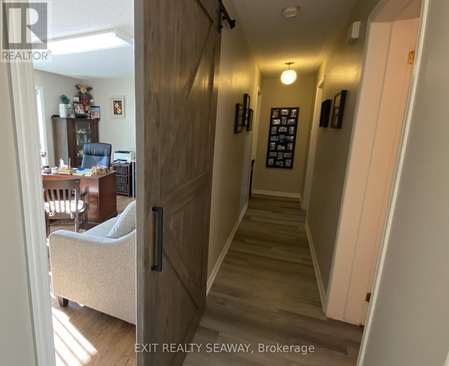 Centre Hallway with Barn Style Door to Den / Offic