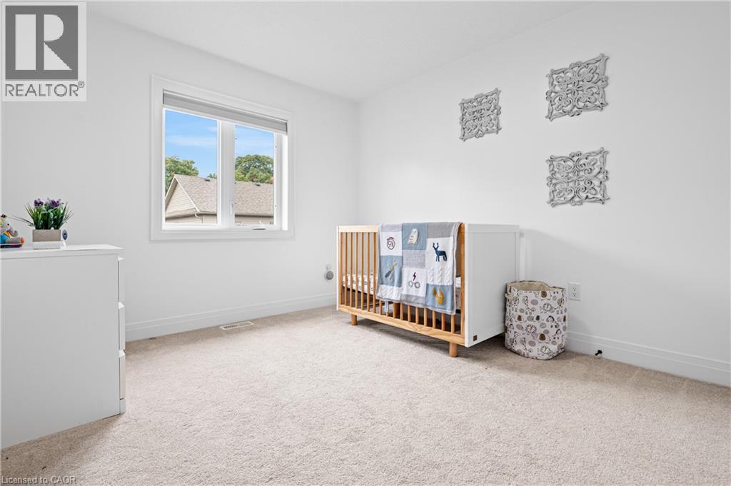 Bright interior room with white walls and light-toned carpeting