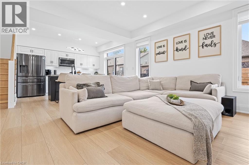 Open-concept living space featuring wood-finish flooring throughout