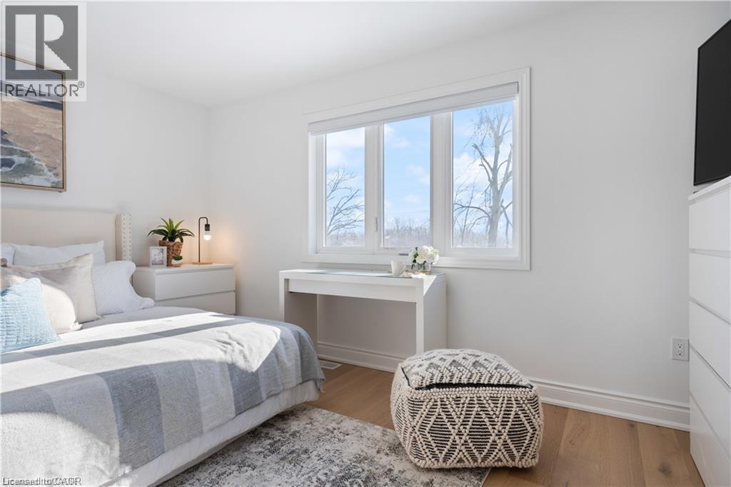Bedroom with light wood-style floors