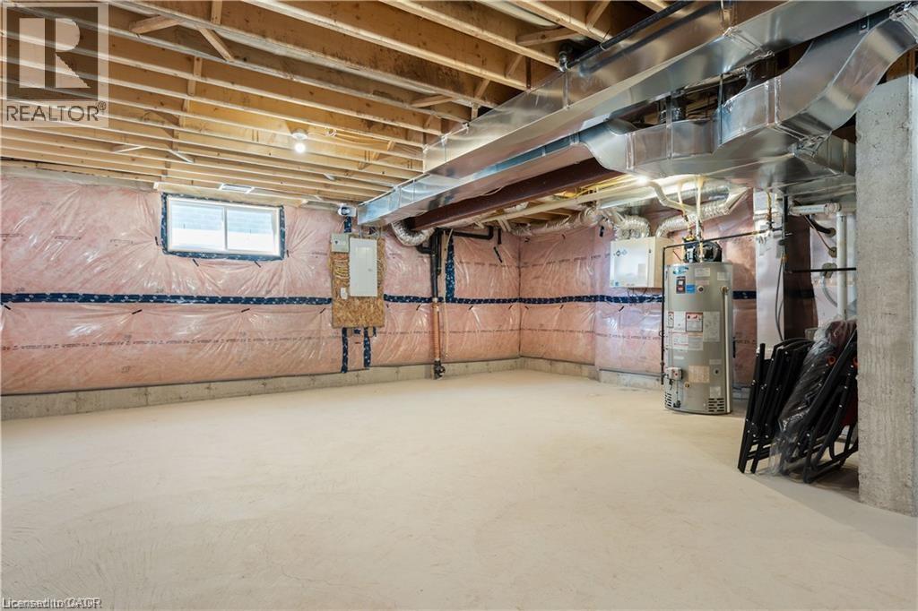 Basement featuring water heater and electric panel