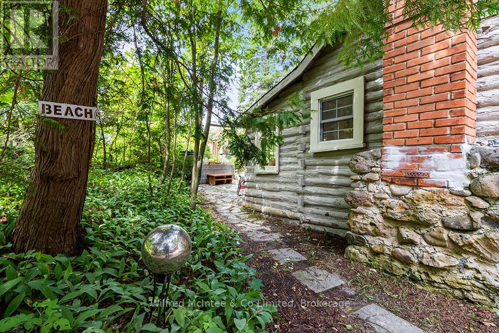 Rustic log and brick exterior
