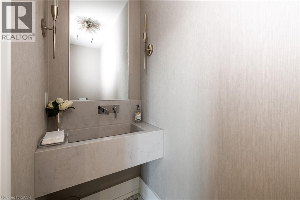Modern floating vanity with integrated sink, wall-mounted faucet, and a rectangular mirror