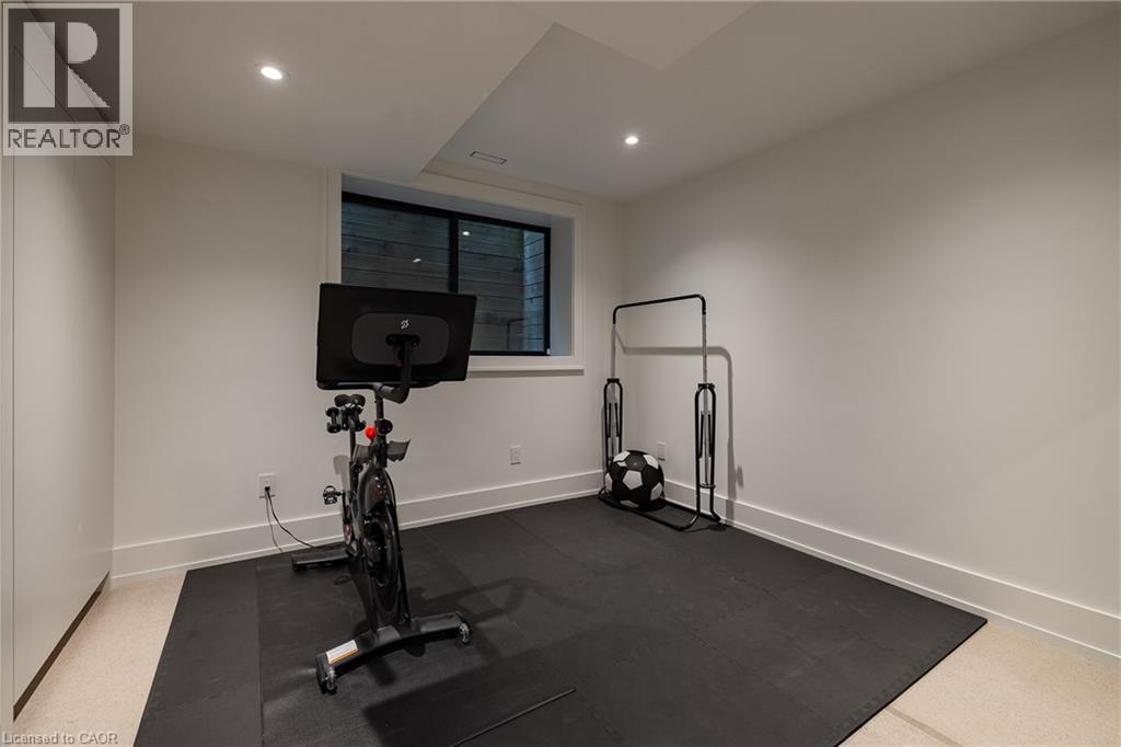 Versatile bonus room featuring recessed lighting, a window, and durable sport flooring