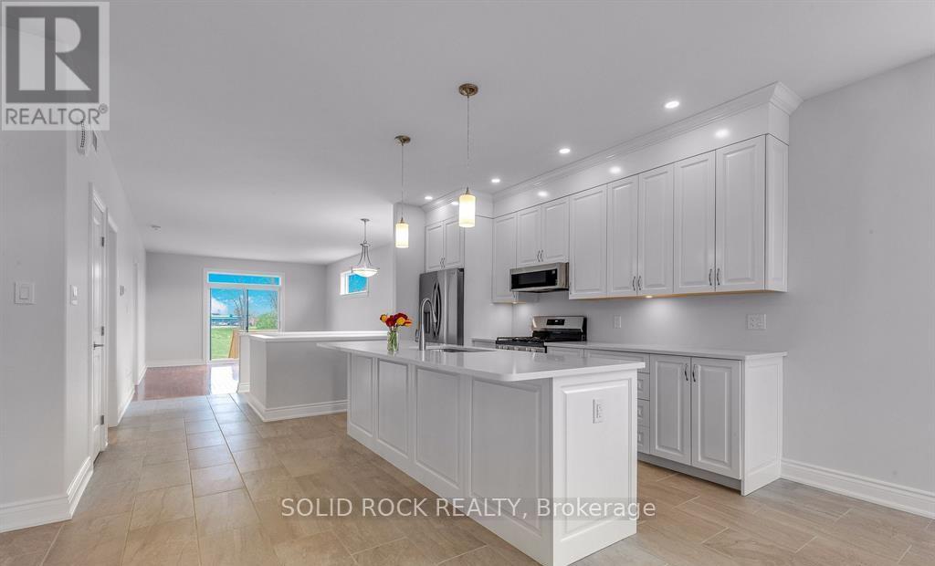 Looking from dining area to kitchen/living area