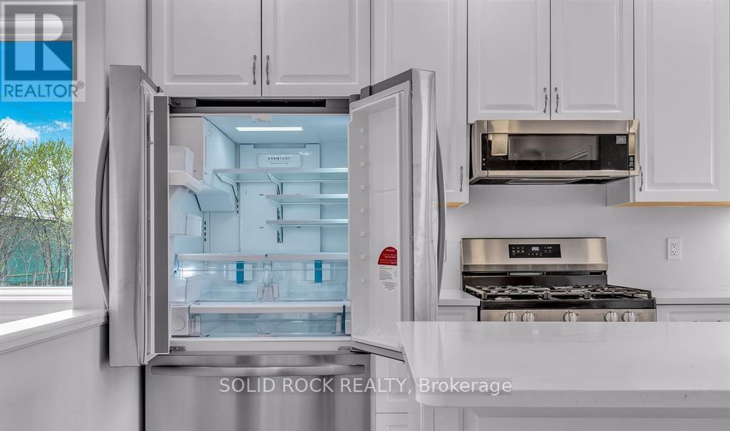 SS french door refrigerator with bottom freezer.