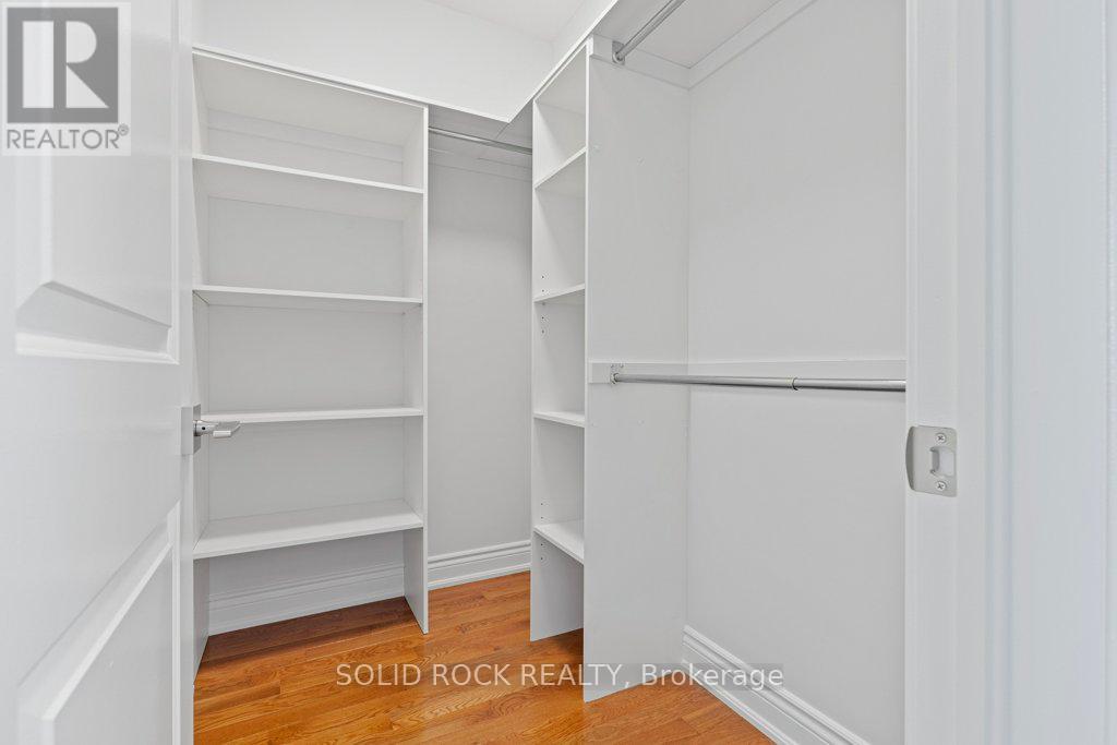 Primary bedroom walk-in closet