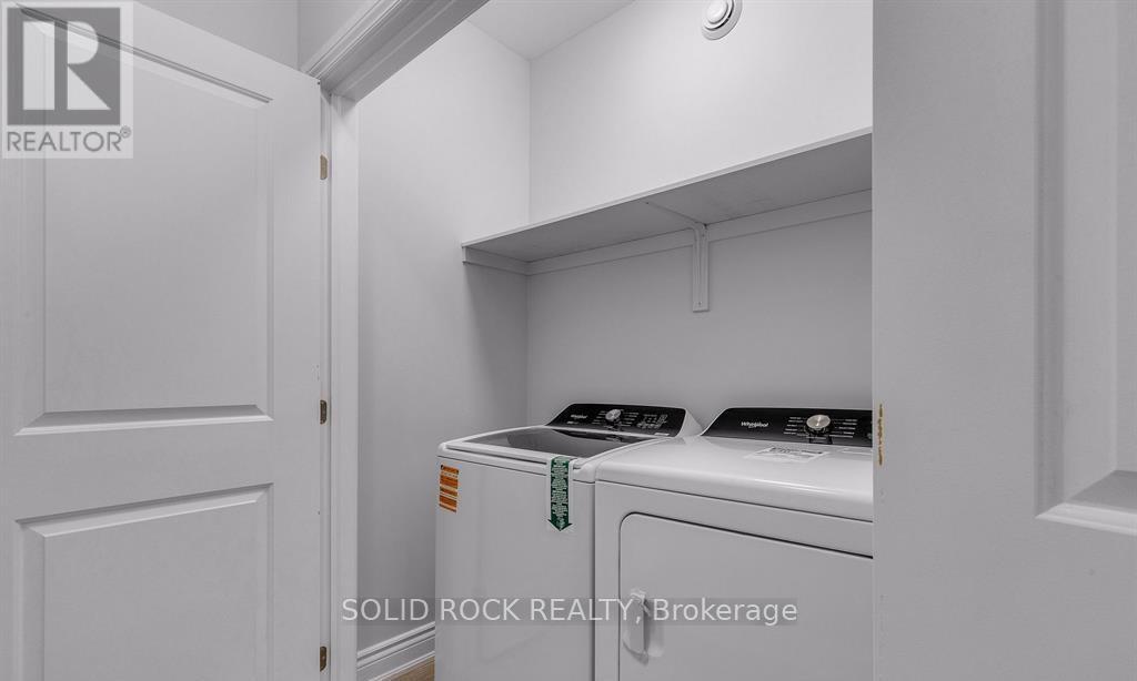 Main floor laundry includes washer & dryer