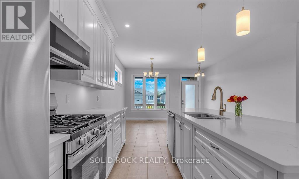 Kitchen in foreground/dining area in background