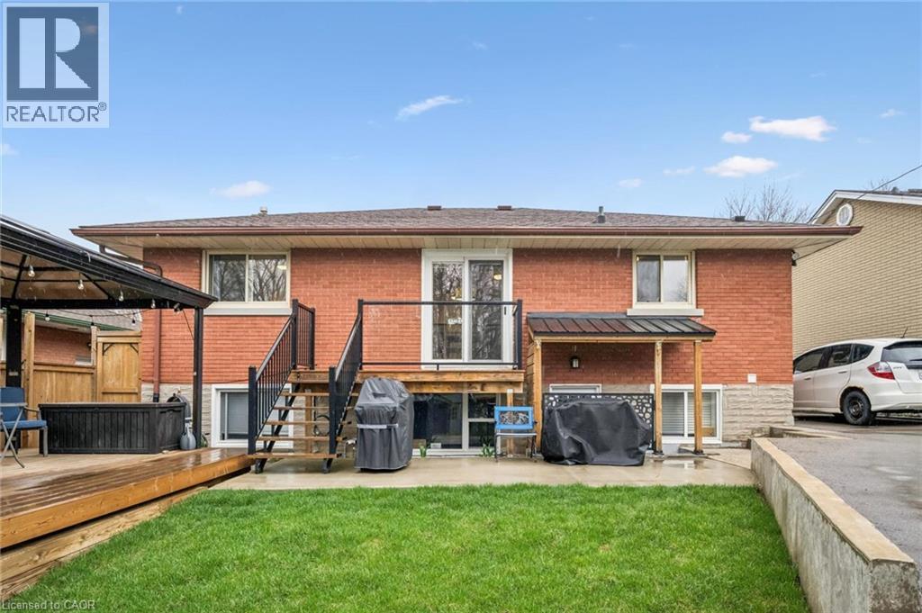Brick exterior with a brown shingle roof