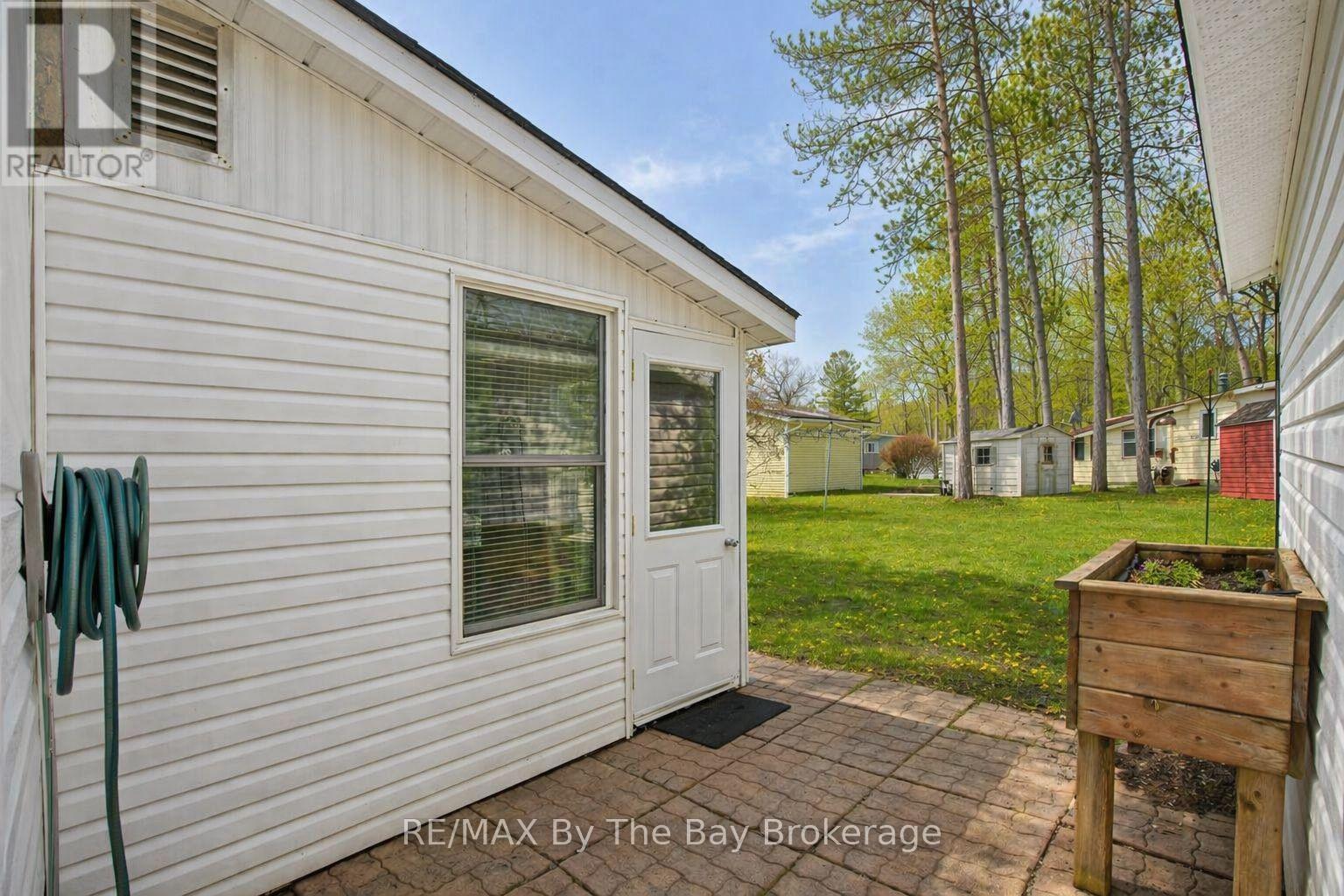 Entrance to Sunroom and Backyard from Car Port