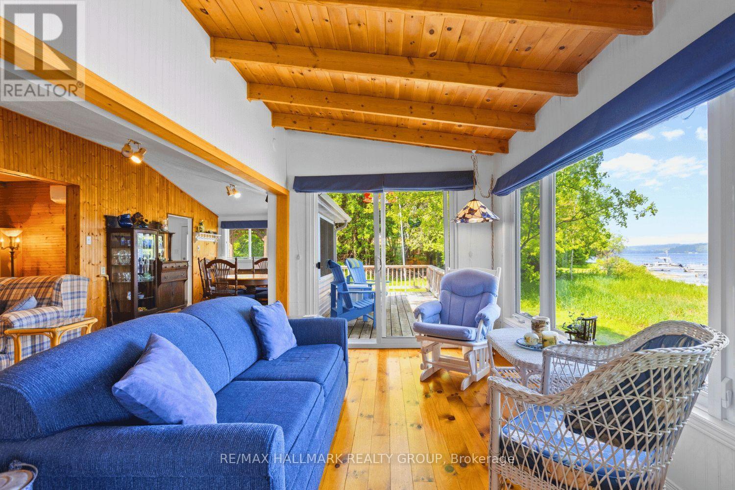 Bright sunroom with panoramic lake views