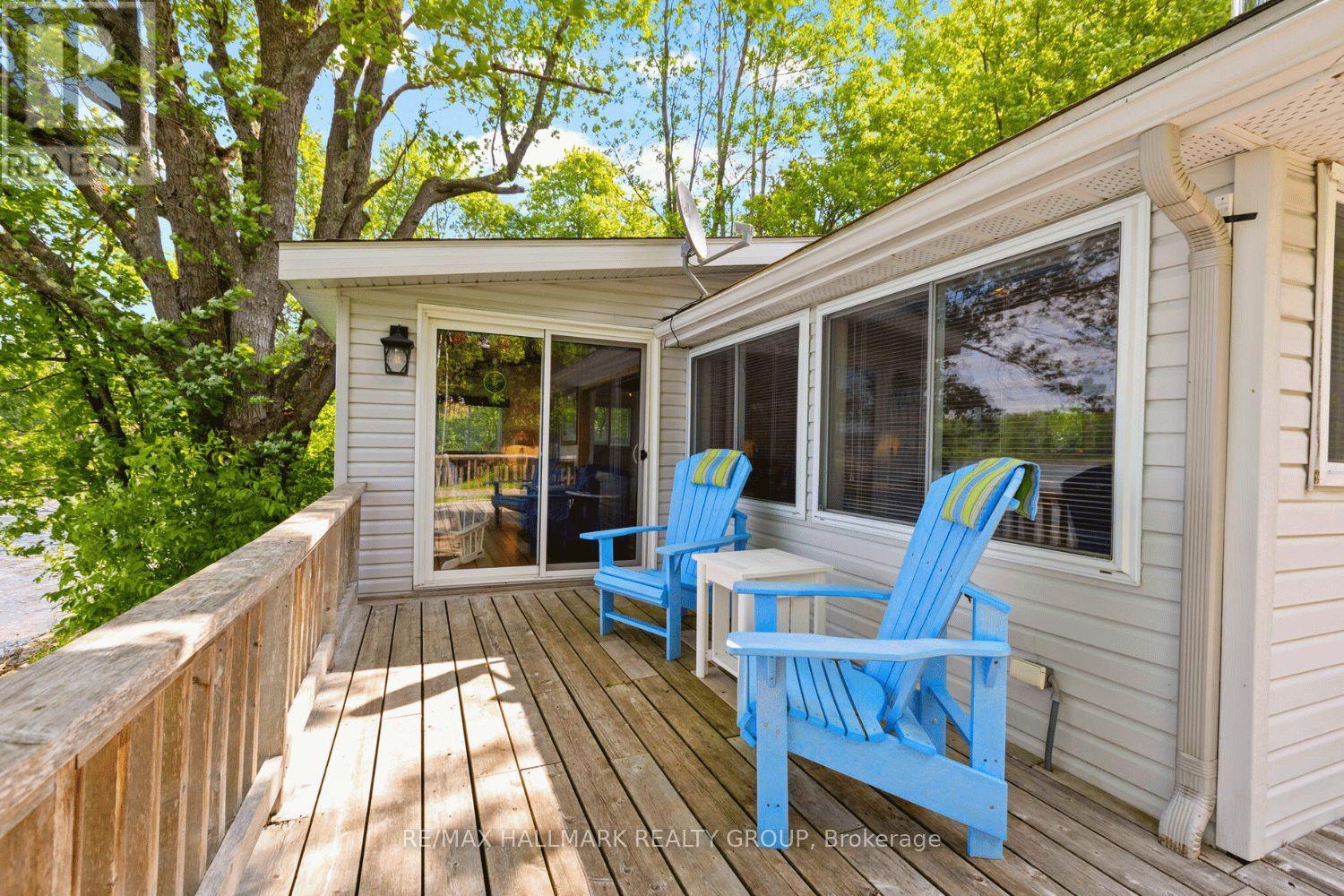 Spacious deck with seating and lake views