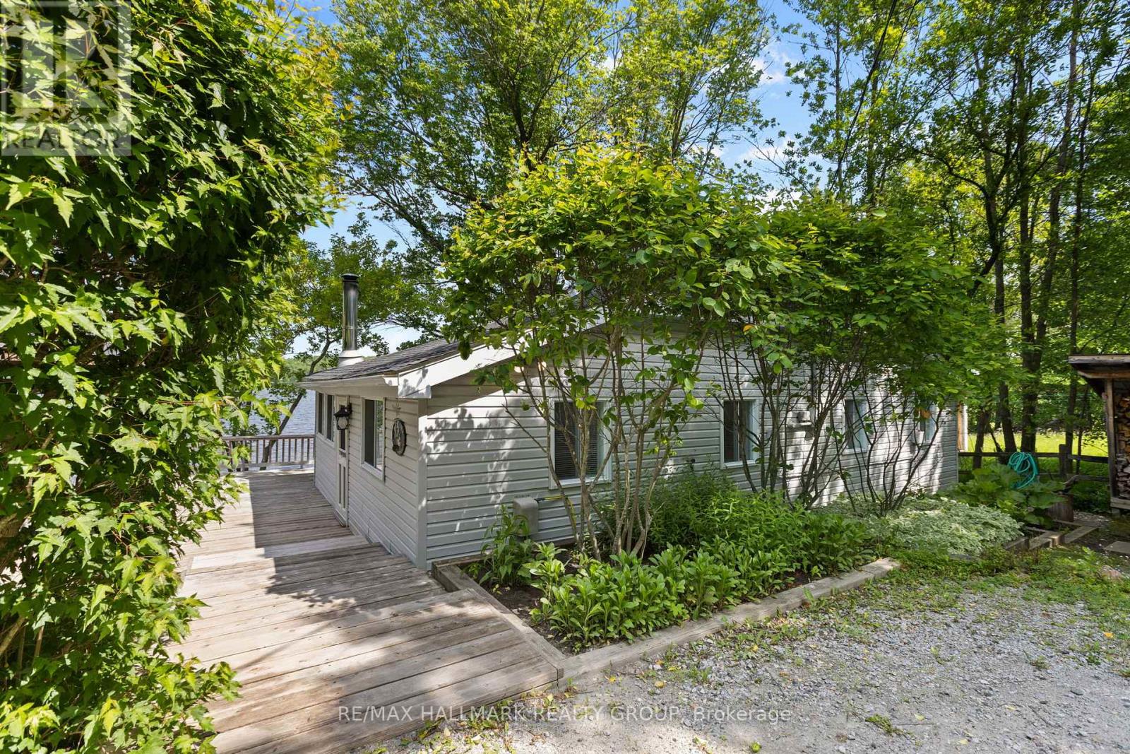 Side yard with greenery and walkway access