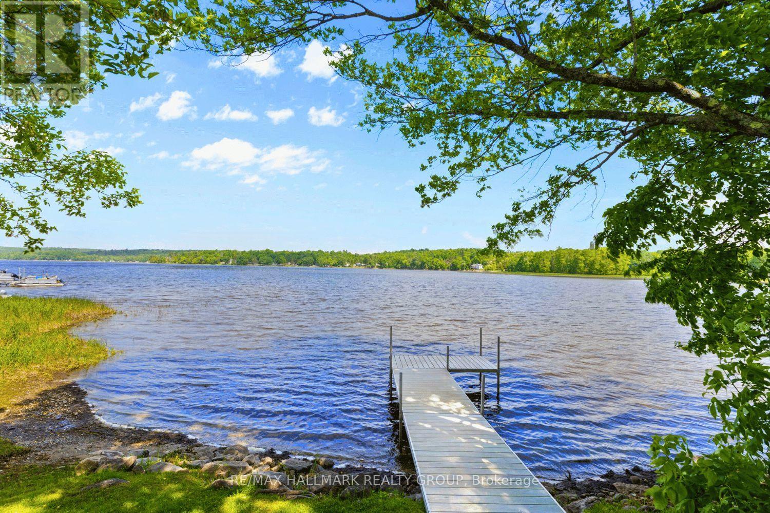 Private dock extending into calm lake
