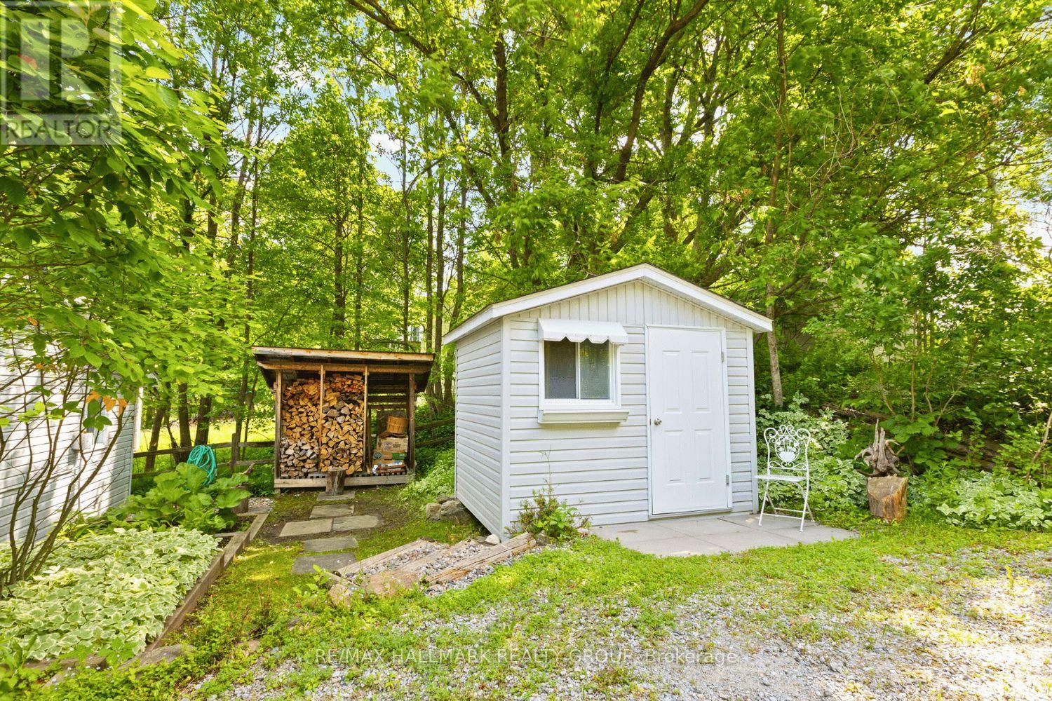 Backyard shed with storage and wood space