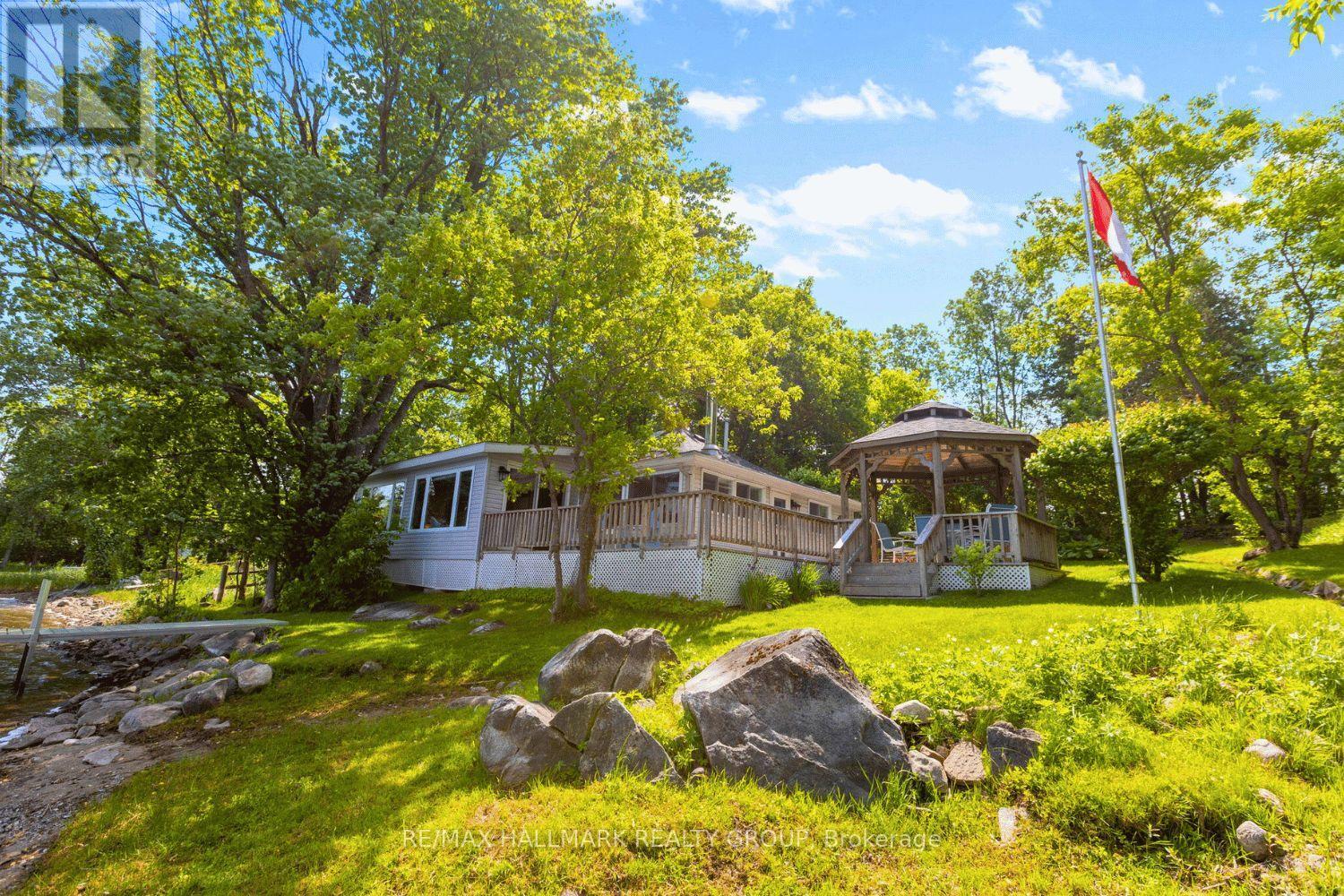 Wraparound deck and gazebo facing water