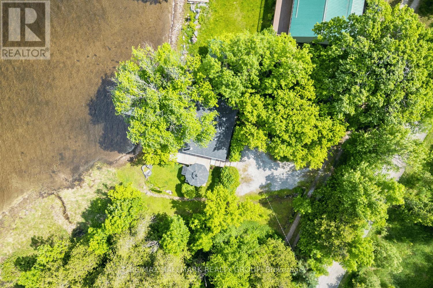 Private treed lot along quiet lakefront edge
