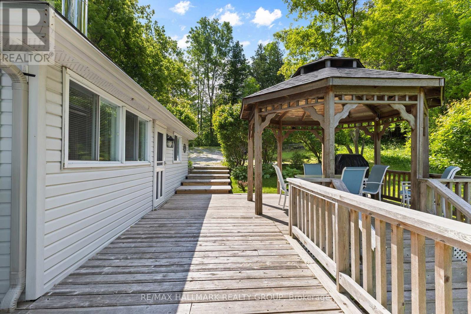 Wraparound deck connecting outdoor spaces