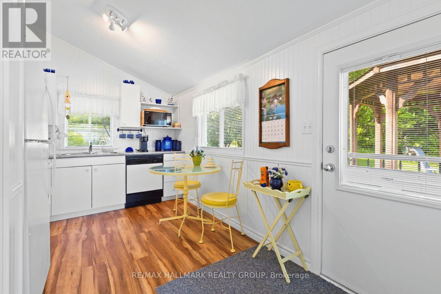 Bright kitchen with dining nook and access