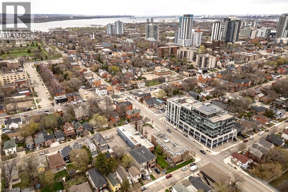 Aerial perspective of a multi-story building featuring extensive glazing
