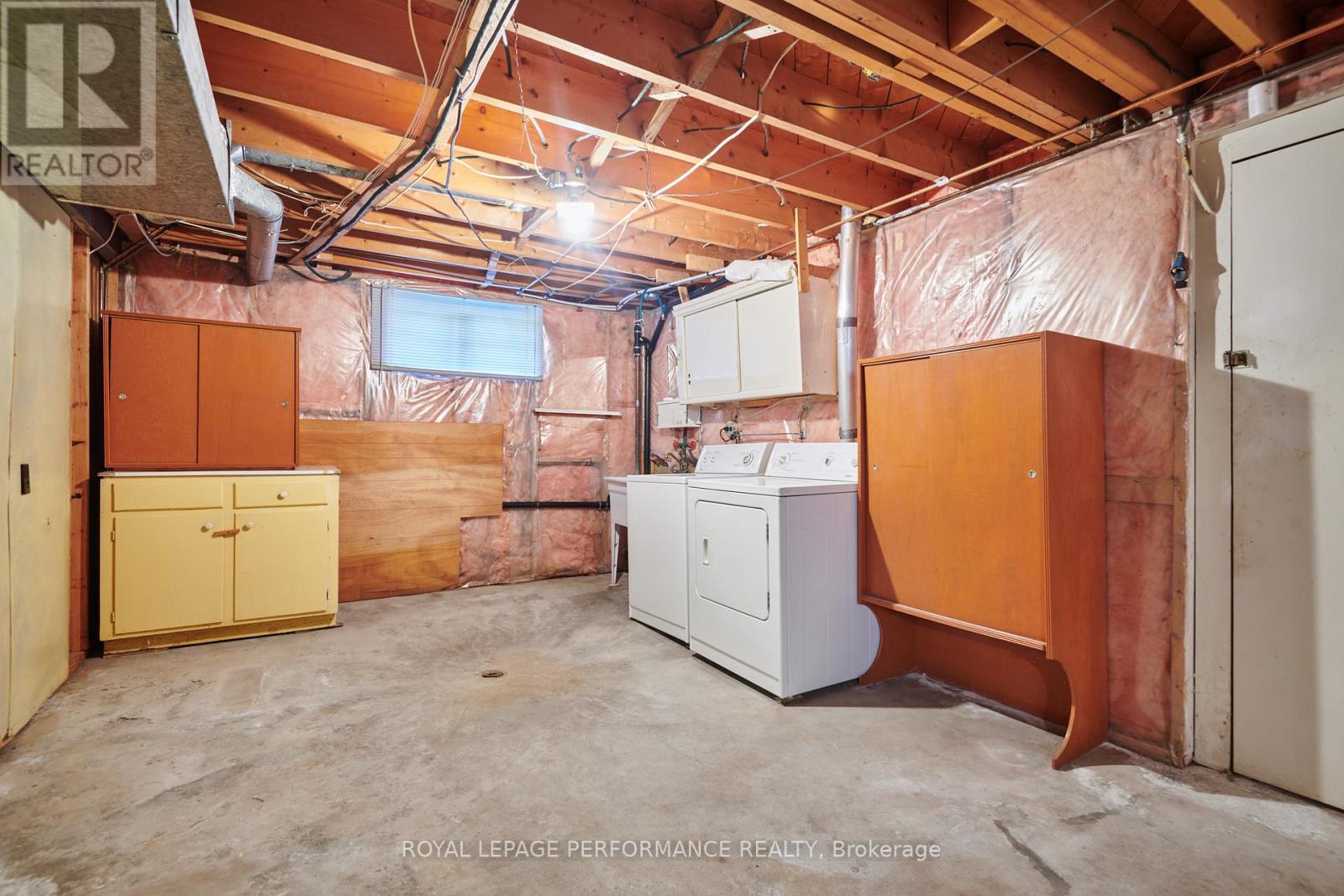 Laundry area in Basement is awaiting your vision!