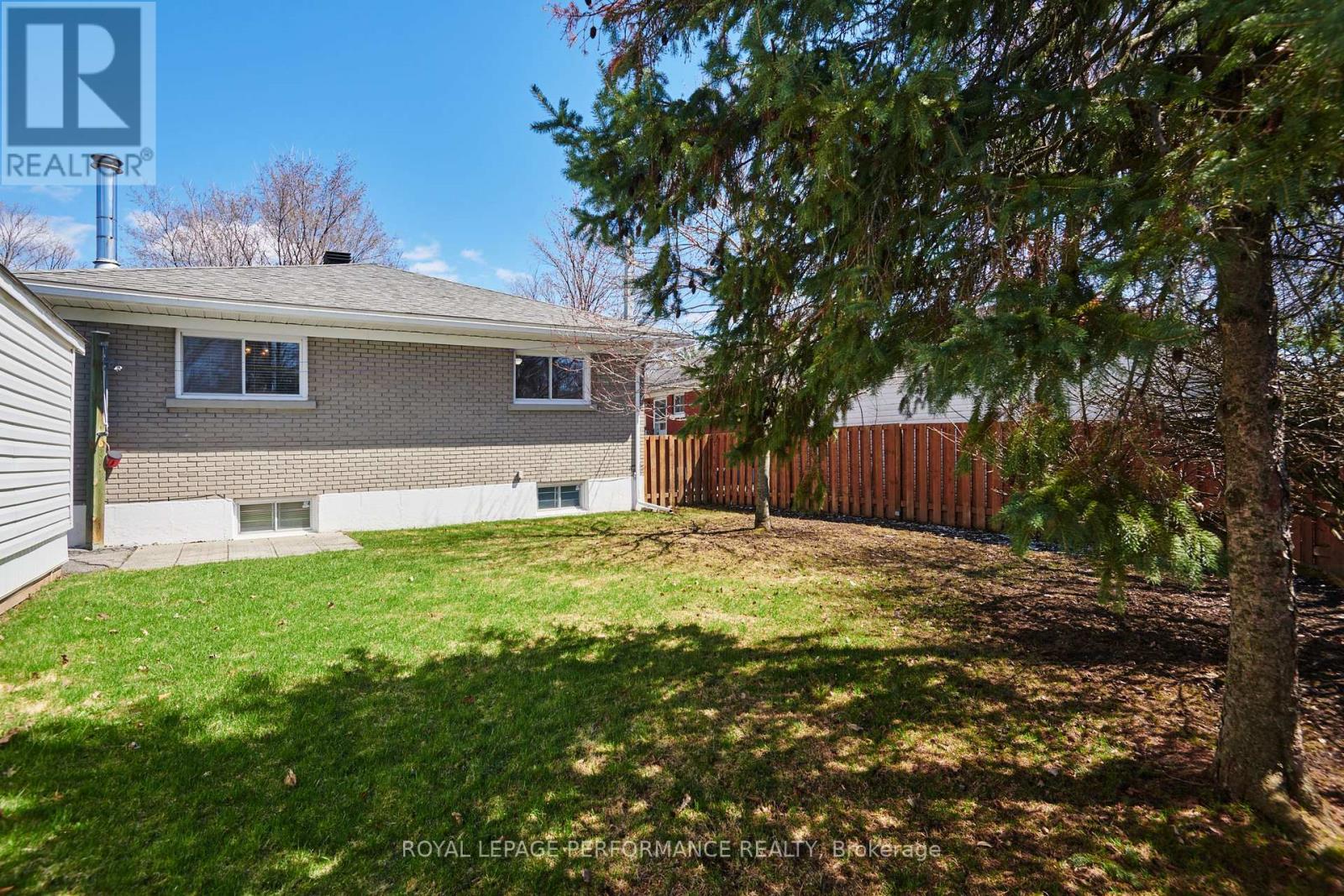 Back exterior and yard w/mature trees