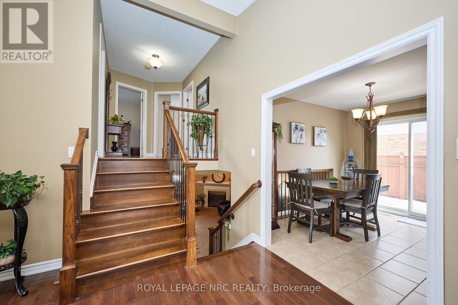 Oak stairwell to upper and lower level.