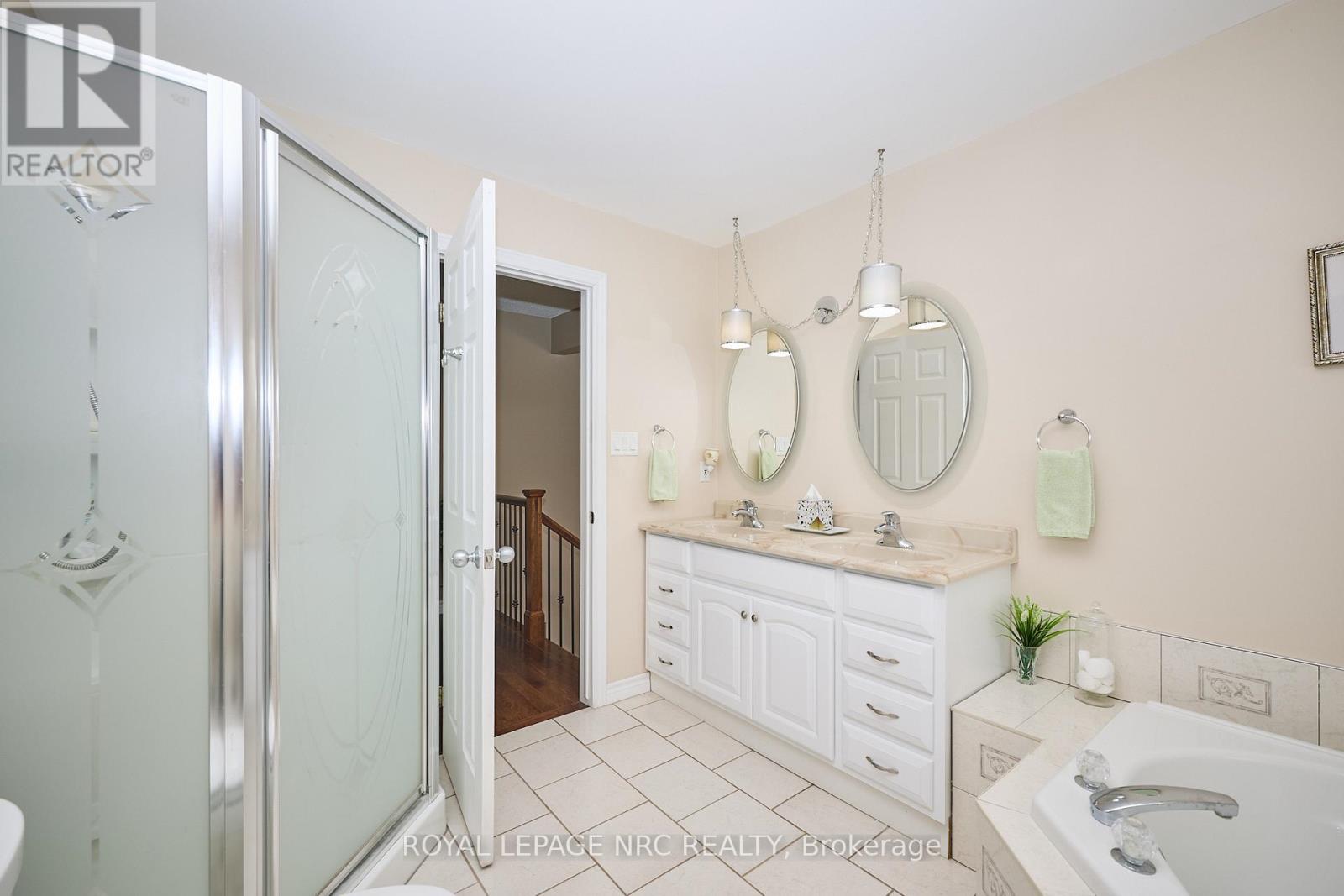 5pc Main Floor Bath. Double Sinks. Glass shower.