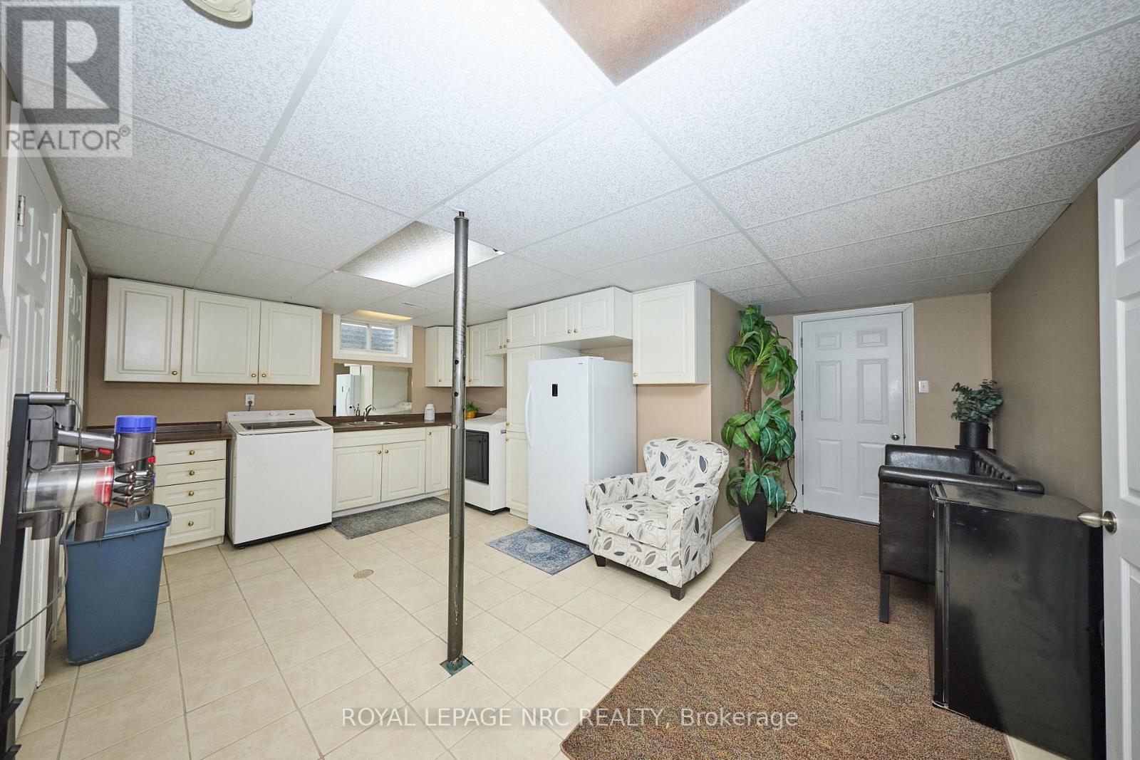 Laundry area and access to fruit cellar.
