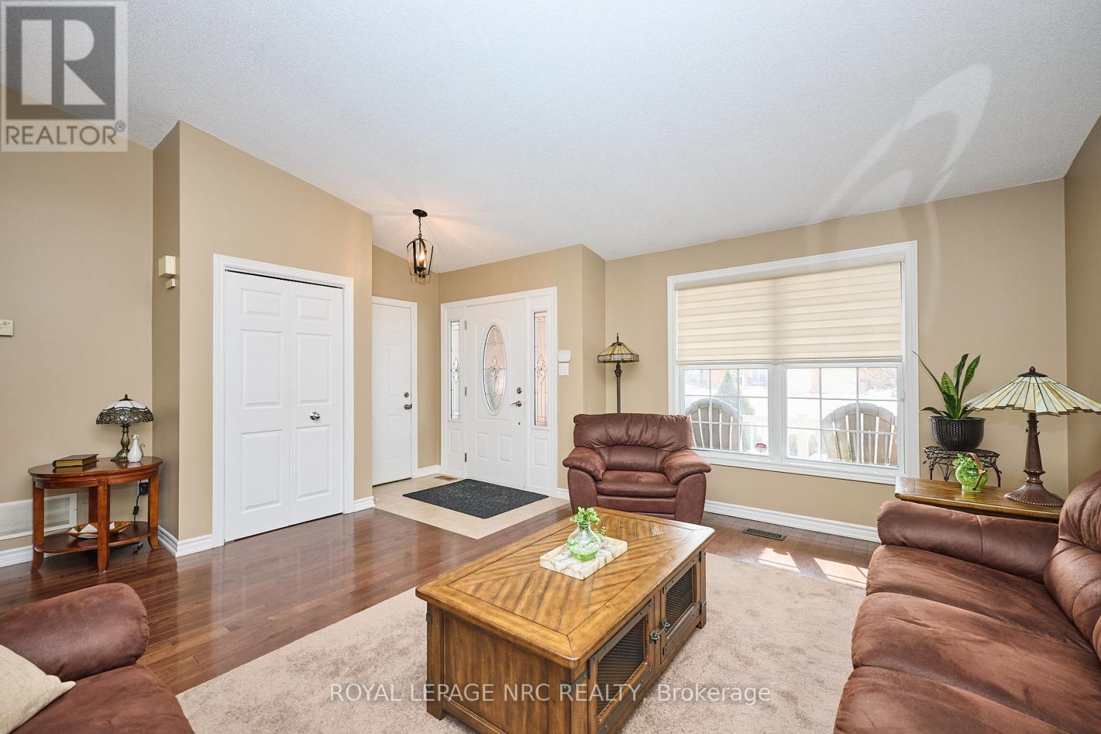 Welcoming foyer w/access from double car garage.