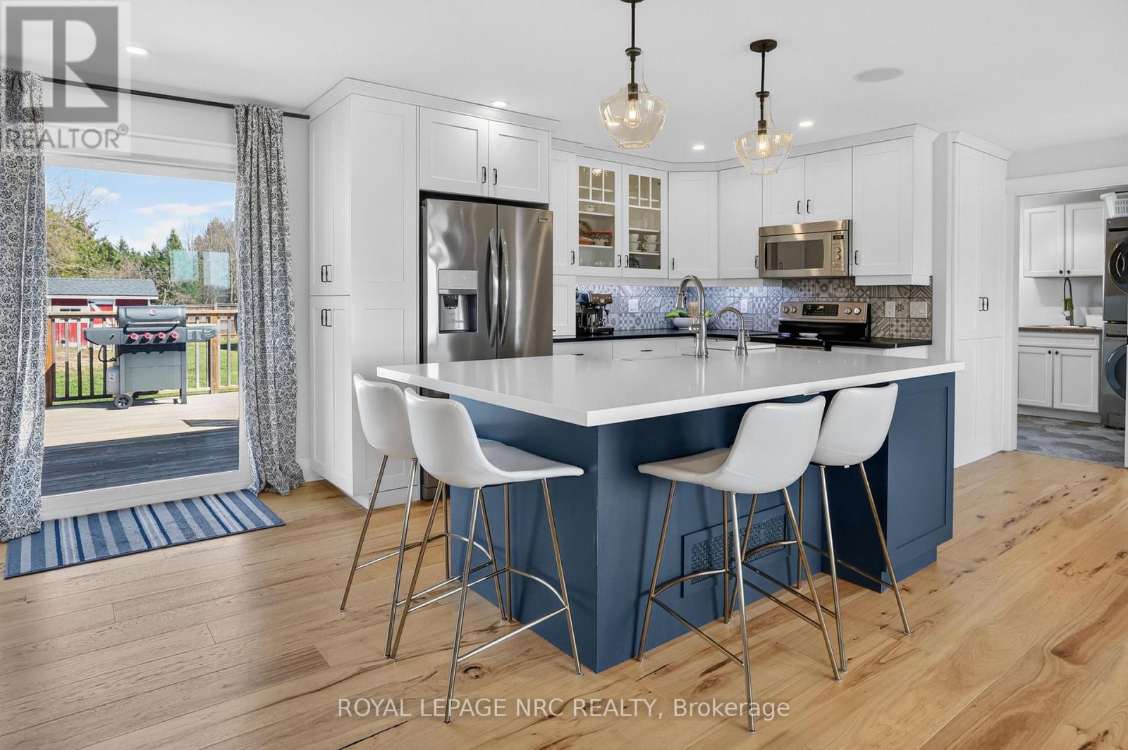 QUARTZ COUNTER AND APRON SINK ADD A COUNTRY FLAIR